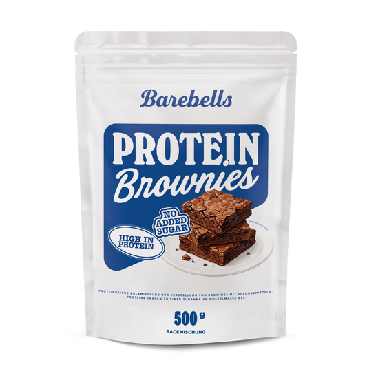 White pouch of Barebells Protein Brownies, a 500 g high-protein baking mix, with blue branding. The front shows the “Protein Brownies” title on a blue background, “High in protein” and “No added sugar” badges, and an illustration of three stacked brownies on a white plate.